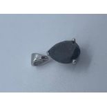 White metal and black diamond pendant