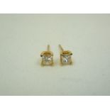 Pair of 9ct gold and diamond set stud earrings.