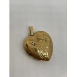 9ct gold diamond set locket