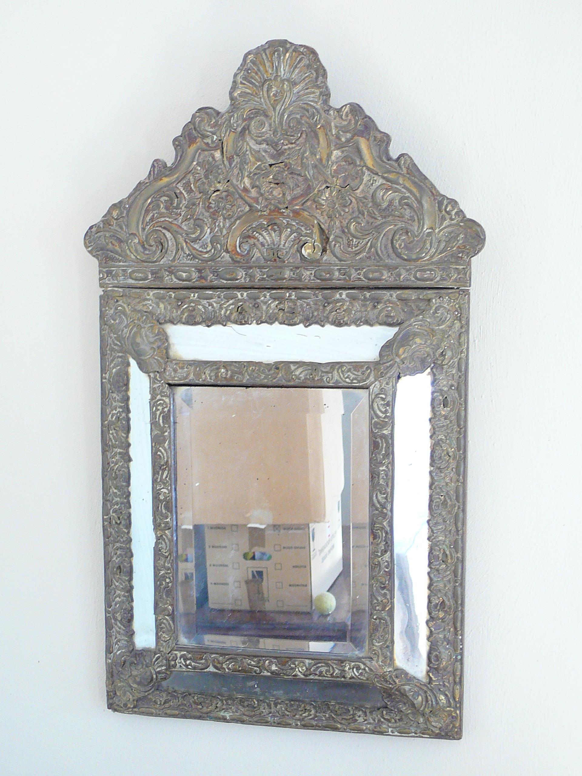 Brass repousse cushion mirror