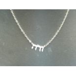 White metal chain and pendant