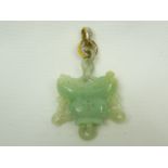 Jade pendant on 18ct gold and diamond bale