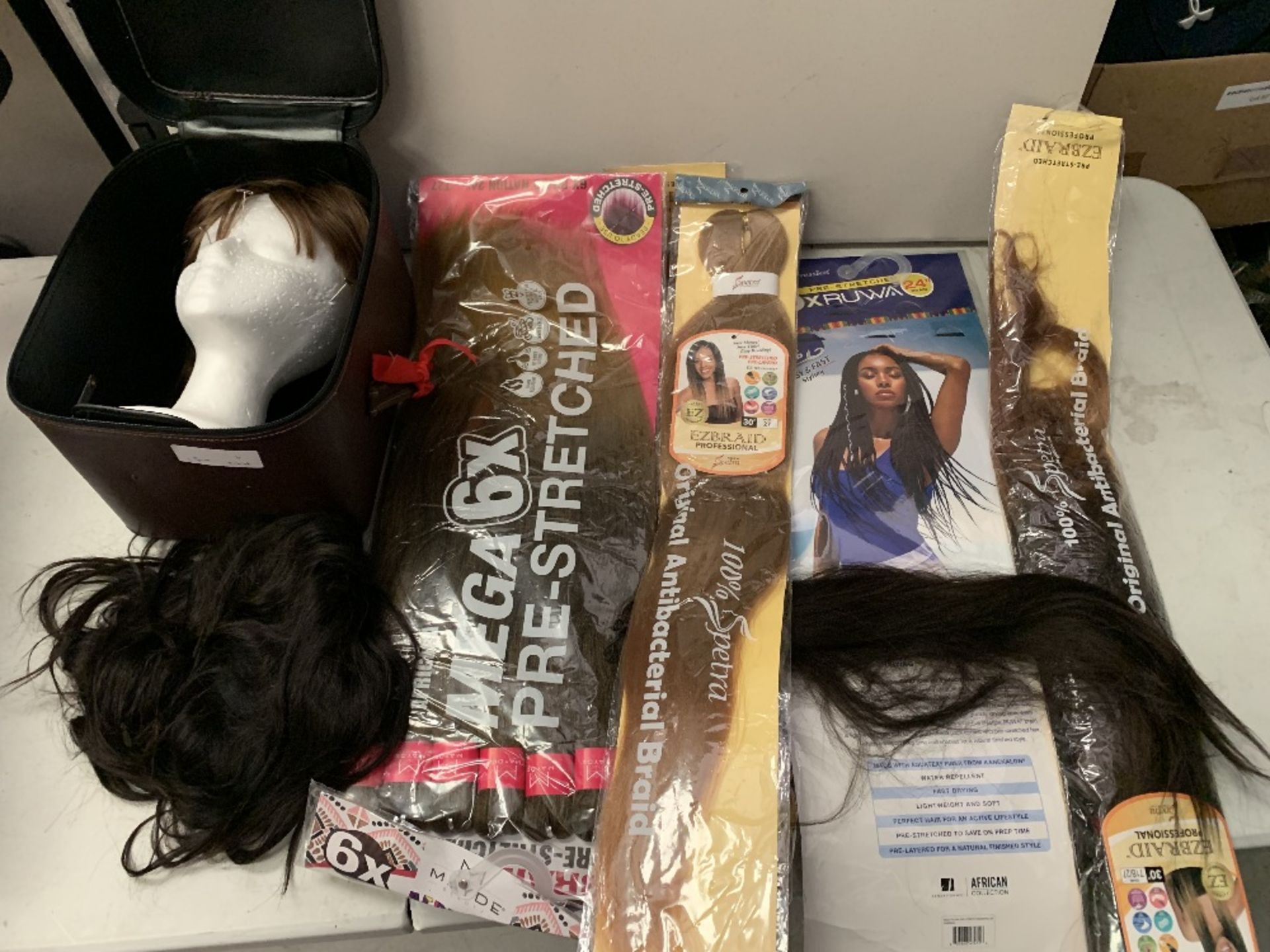 Wigs and hair extensions in one box.