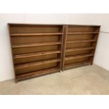 A pair of pine bookshelves with moulded detail to top.W:125cm x D:23.5cm x H:138cm
