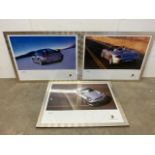 Three framed large scale Porsche posters Carrera GT and 911 Turbo etc.