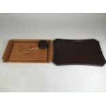 A hand painted lacquer tray with a marquetry tray and a dark wood coaster