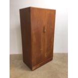 An Austin suite teak veneered double wardrobe.W:91cm x D:59cm x H:173cm