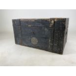 A large school trunk with pine interior and metal bound top. Stamped J.E.C.M Candlish. W:67cm x