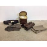 A mixed lot of textiles and militaria. To include collars of varying size in leather cases,