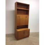 A G Plan two piece wall storage unit with shelves above drop down bureau with sideboard base below.