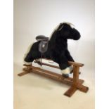 A Mamas & Papas rocking horse.