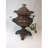 An early 20thC copper and brass samovar, of shaped bellied form on an inverted stem and platform