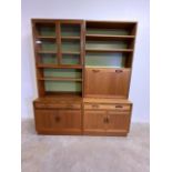 Two mid century G-Plan wall units. Glazed doors to shelves above a sideboard along side open shelves