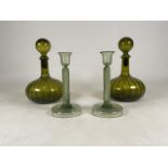 Two spiral green glass decanters with two light green glass candlesticks