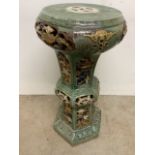 A pottery majolica jardinaire stand.W:38cm x D:38cm x H:76cm