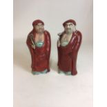 Two Oriental ceramic figures of robed Taoist monks H:25cm