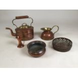 A collection of five copper items to include a teapot, wine holders and other items