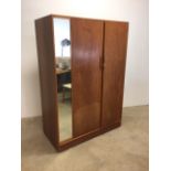 An Austin suite double wardrobe with side mirror.W:122cm x D:59cm x H:173cm