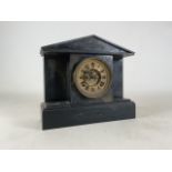 A slate eight day mantle clock.