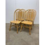 Four hardwood kitchen stick back dining chairs.W:47cm x D:43cm x H:96cm