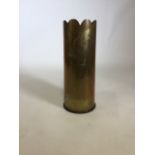 A WW2 shell casing converted into a brass umbrella stand. Inscribed 1940. 5.25 inch.