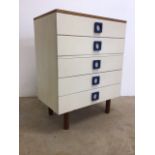 A mid century Unifiex teak and white veneered chest of five drawers in the manner of Gunther