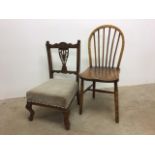 An oak stick back chair and an upholstered nursing chair.