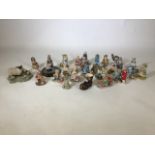 An assortment of figurines by Cherished Teddies, Border Fine Arts and Lilliput Lane.