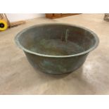 A large circular French copper bath. W:88cm x D:88cm x H:34cm