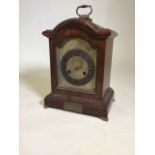 An early 20th century arched top bracket clock by Junghans of Wurttenberg with gilt dial and