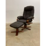 A brown leather reclining arm chair with footstool.W:78cm x D:80cm x H:107cm