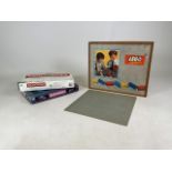 A Lego System building block set with board together with two board games; Monopoly and scrabble.