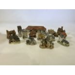 A collection of seventeen model houses to include David Winter models and others