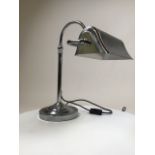 A chrome desk lamp in the Art Deco style. Maximum height 57cm.