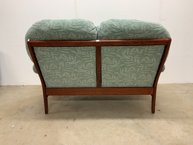 An Ercol style two seater upholstered sofa.W:140cm x D:89cm x H:97cm - Image 3 of 3