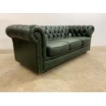 An olive green leather button back three seater chesterfield.W:208cm x D:93cm x H:76cm