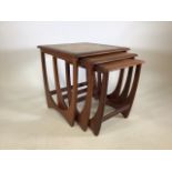 A teak G-Plan nest of tables with quadrant tile decoration to the top of the largest. Largest: W: