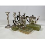 Silver plated coffee tea and water pots along with silver plated candlestick and onyx items.