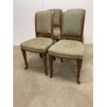 A Maple and Co set of four dining chairs, pitched pine with upholstered seat. Stamped Maple and Co