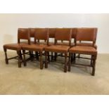A set of eight oak leather pub chairs with large stud work finish.W:48cm x D:40cm x H:80cm