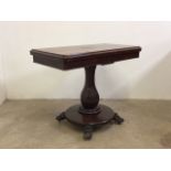 A Victorian rosewood folding card table with octagonal pedestal, circular platform with lion feet