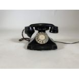 A vintage Bakelite telephone.W:24cm x D:17cm x H:17cm