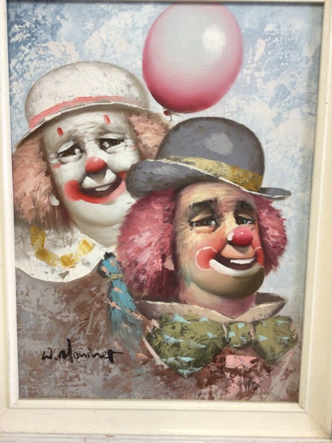 Oil on canvas of a pair of clowns in white painted frame. Signed W.Moninet. W:29cm x D:cm x H: