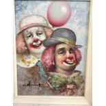 Oil on canvas of a pair of clowns in white painted frame. Signed W.Moninet. W:29cm x D:cm x H: