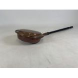 A early 20th century copper bed pan