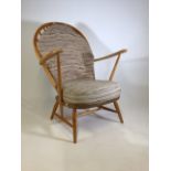 An Ercol style beech wood armchair W:75cm x D:63cm x H:96cm