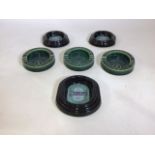 A selection of commercial ashtrays from Heineken and Whitbread & Co.