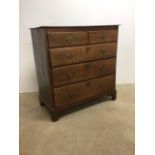 An oak chest of drawers with brass handles.Two short drawers over three long.W:98cm x D:52cm x H: