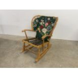 A 20th century pine rocking chair. W:85cm x D:90cm x H:84cm