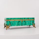 A late 19th early 20th century Russian malachite veneered jewellery box with ormolu mounts and